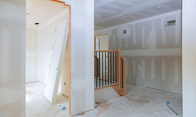 walls plasterboards with room under construction with finishing putty in the room